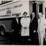 The Bookmobile Goes to Moscow: on the Finn Lines pier in Brooklyn with l. to. r. bookmobile builder Thomas F. Moroney, library board president Theodore Wenzl, John Mackenzie Cory of the American Library Association, and Thomas J. McLaughlin, head of the Combined Book Exhibit delegation (Publisher’s Weekly 5.25.59, photo by Robert Berenson)