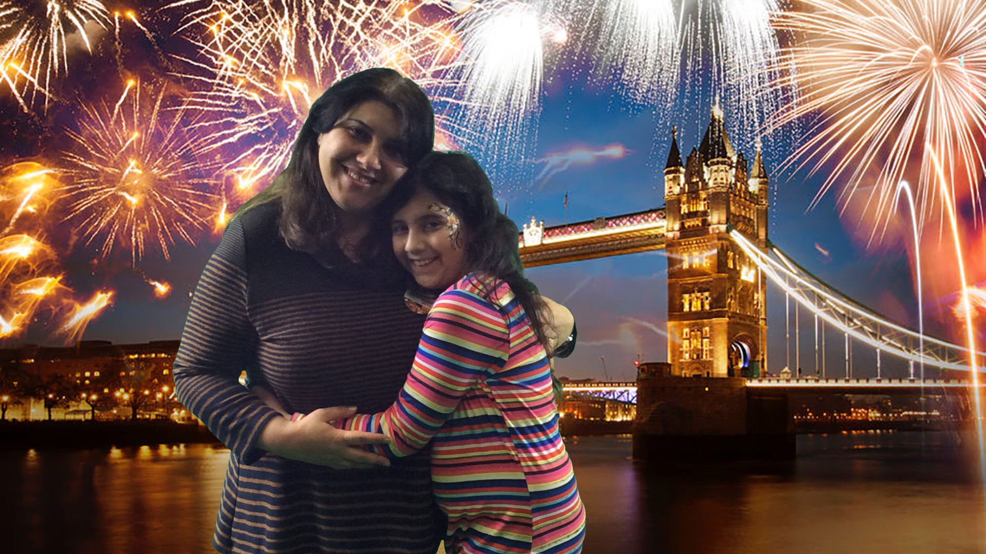 woman and girl hugging with London bridge and fireworks background